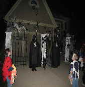 Halloween guard awaiting trick or treaters at Spookystreet.com